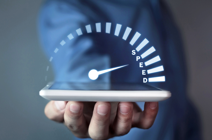 man-holding-tablet-with-speedometer-speed-concept